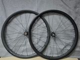 a pair of wheels are sitting on a wooden table
