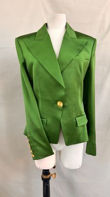 a green blazer jacket on a mannequin mannequin mannequin mannequin mannequin mannequin mannequin mannequin mann