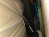 an image of a room with a bed and a suitcase