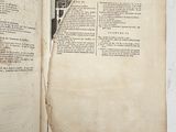 an open book with a picture of a man in a room