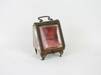 a small red glass box with a chain around it