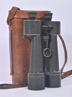 two binoculars sitting next to each other on a white surface