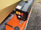 a small engine that is attached to the back of a truck