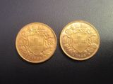 deux pièces d'or, dont l'une porte un blason et l'autre un bouclier