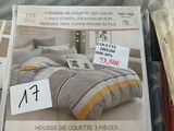 boxes of bedding and pillows for sale in a store