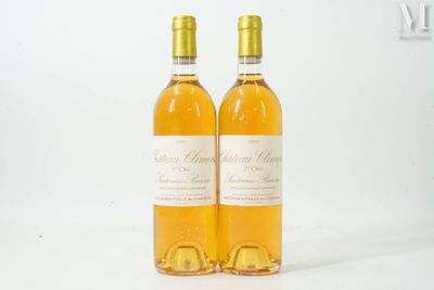 two bottles of wine sitting next to each other on a table