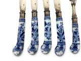 four blue and white china knives and spoons with silver handles