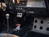 a dashboard and steering wheel of a car with a clock on it