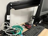 a computer desk with a keyboard and a monitor on it