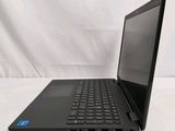 the laptop is sitting on a white surface with a black keyboard