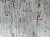 a close up of a rusted metal plate on a wall
