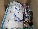 a cardboard box filled with a lot of items