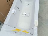 a white bath tub sitting on top of a table