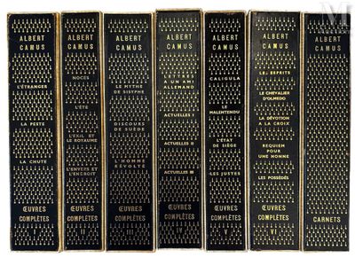 a set of five books with black covers and gold lettering