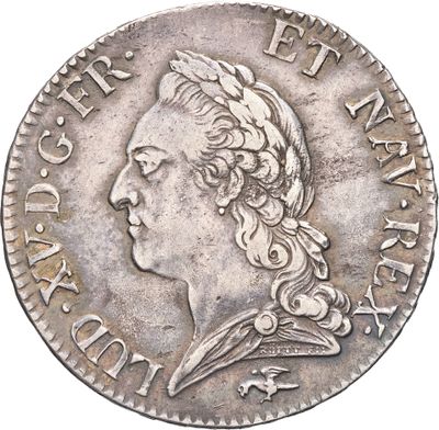gros plan d'une pièce de monnaie sur laquelle figure une tête de femme
