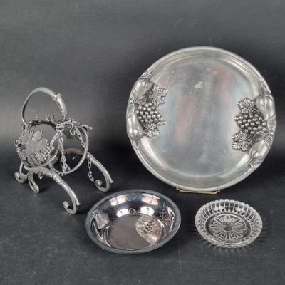several pieces of silverware including a tray, bowl, and spoon