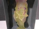 a glass vase that is sitting in a black box
