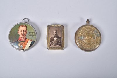 three different types of medals are displayed on a white surface