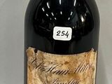a bottle of wine that is sitting on a table