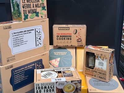 several boxes of food are stacked on top of each other on a table
