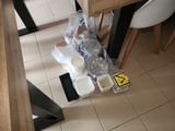 a lot of items on the floor of this kitchen