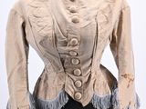 an image of a woman ' s jacket on a mannequin