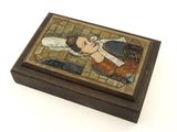 an image of a small wooden box with a painting on it
