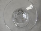 a glass of water sitting on a counter top