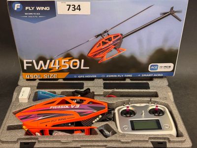 une boîte contenant une télécommande et un hélicoptère télécommandé