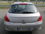 a silver car that is parked on the side of the road