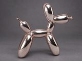 an image of a silver balloon dog sculpture on a grey background