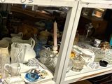 many glass items on the shelves in the store