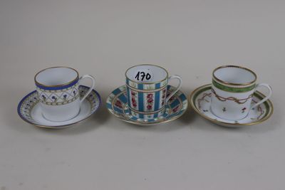 three cups and saucers are sitting side by side on a table