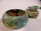 a group of bowls sitting on a table next to each other