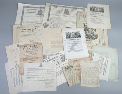 several old papers are piled on top of each other on a table