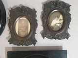 three framed pictures of a woman and a man on the wall