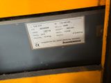 a label on the side of a machine that is yellow