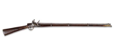 un vieux pistolet avec un canon en bois et une poignée en métal