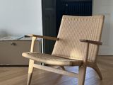 a chair that is sitting in the middle of a room