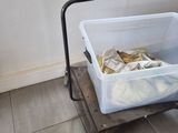a plastic container sitting on top of a metal cart