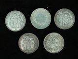 four silver coins with the image of jesus and other religious figures on them
