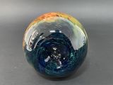 a glass ball that is sitting on a table