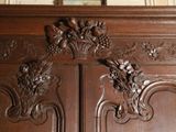 a picture of a wooden cabinet with a mirror above it