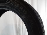 tire tread of a car on a white surface with a white background