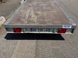an image of a flat bed trailer parked in a parking lot