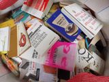 a pile of books in a bag on the floor