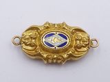 an image of a close up of a gold and blue broochle