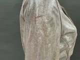 an image of a mannequin wearing a shiny jacket