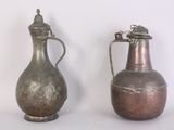 two vases sitting next to each other on a table