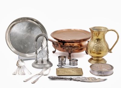 a lot of silver and gold items on a white surface